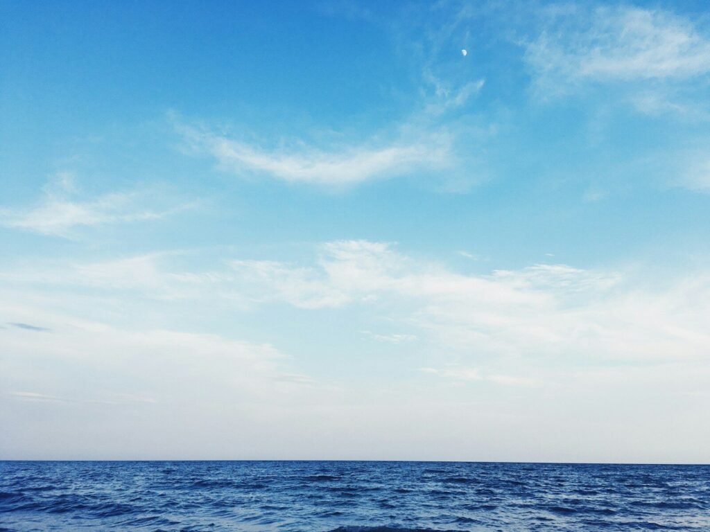 blue ocean under blue sky during daytime